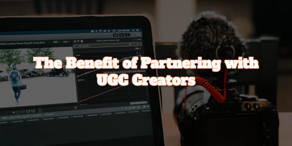 A photo of a laptop and a camera with a microphone. There is text-overlay on the photo that states "The benefits of Partnering with UGC creators." 