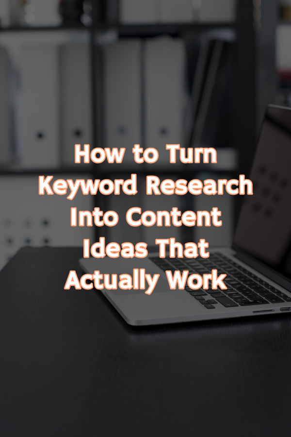 Pinterest image showing a laptop on a work desk and text-overlay on the image stating "How to turn keyword research into content ideas that actually work." 